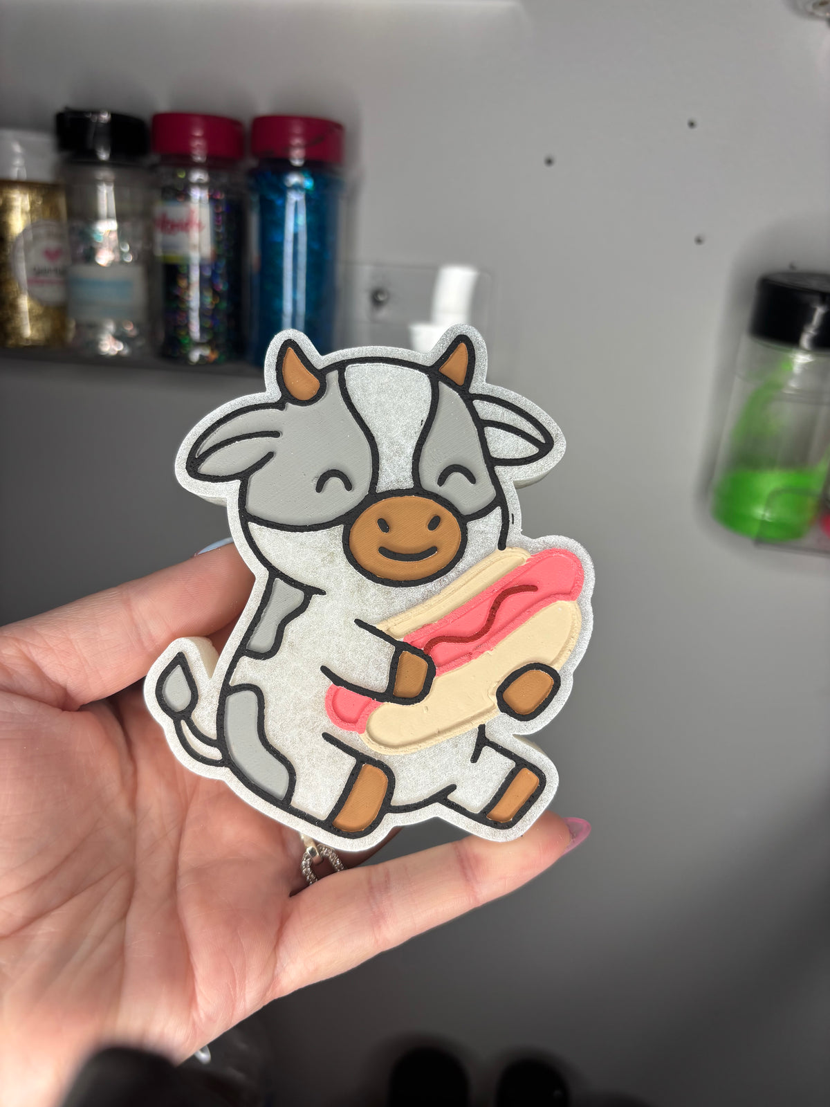 Cow with hot dog